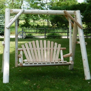 Porch, patio, deck or lawn swing made of cedar for outdoors.