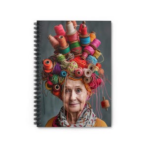 May include: A woman with a colorful and whimsical hat made of yarn and thread. The hat is a vibrant mix of red, pink, blue, green, and yellow yarn. The woman is smiling and looking directly at the camera.