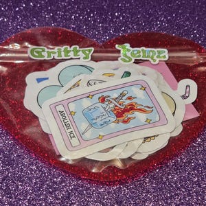 This sticker set comes packaged in a reusable, heart-shaped red glitter pouch with a clear front so you can see the designs inside. The pouch is securely sealed to keep the stickers protected during shipping. The vibrant, gift-ready packaging makes it perfect for storage, display, or easy gifting while keeping your stickers safe and organized.