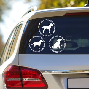 May include: Three white vinyl car decals with black text and dog silhouettes. The top decal reads "ESA on Board Do Not Separate From Handler". The left decal reads "Service Dog on Board Do Not Separate From Handler". The right decal reads "Service Dog on Board Do Not Separate From Handler".