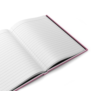 May include: An open notebook with lined pages and a pink cover. The notebook is open to a blank page.