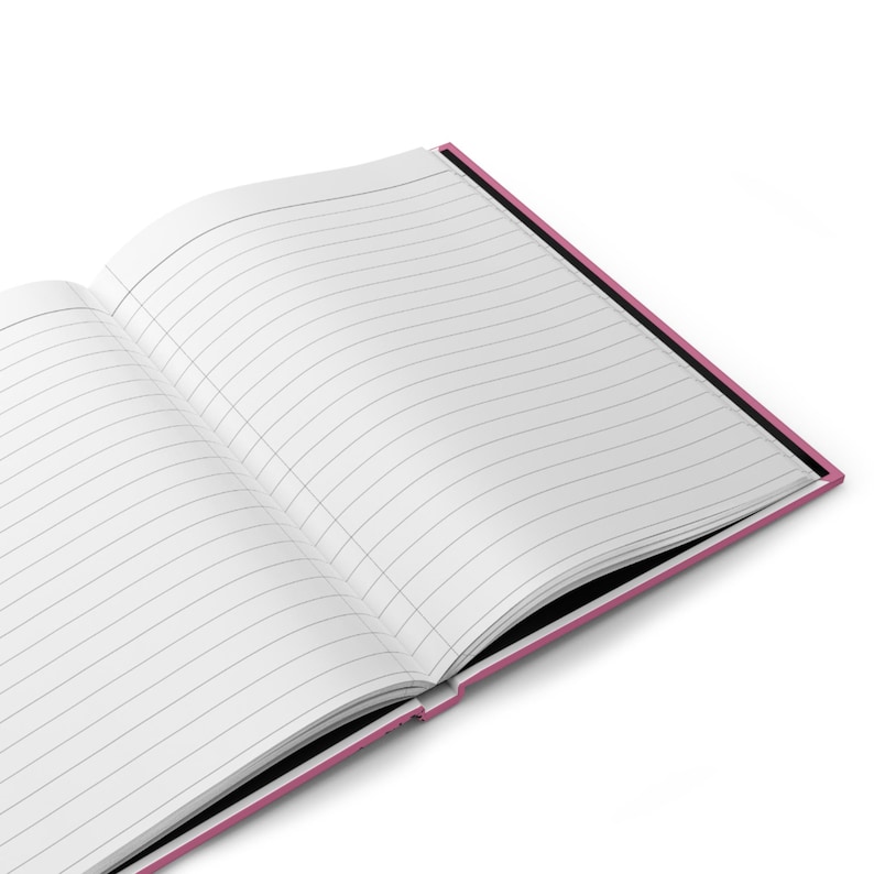 May include: An open notebook with lined pages and a pink cover. The notebook is open to a blank page.