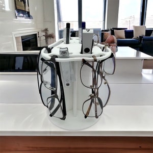 Eyeglasses organizer holds up to 12 glasses plus 6 slots on the top to put other items made from king starboard Marine Plastic .