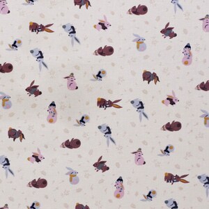 May include: A white fabric with a repeating pattern of brown, pink, and gray bunnies in various poses. The bunnies are wearing hats and scarves. The background is a light cream color with a subtle floral pattern.