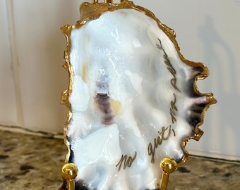 Hand painted real oyster shell from the Pacific Northwest’s coast with “No grit, no pearl” written on it. BEAUTIFUL shell. Stand additional.