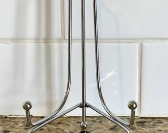 Silver plated display stand/holder/easel, 8 inches tall, opens to approx 7.5 inches wide.