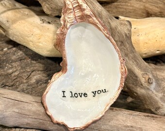 Decoupaged cloth “I love you” with rose gold trim on a real, oyster shell, beach combed along the Outer Banks of NC.
