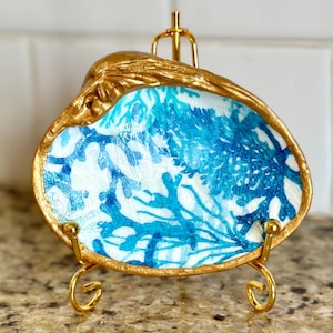 Decoupage blue coral pattern on a hand painted, real clam shell.  *Shown on a 4” display stand (additional cost).*