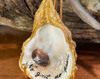 Real oyster shell, beach combed along Florida’s gulf coast with “No grit… no pearl” hand painted on it.