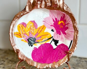 Decoupage pink and yellow floral Marimekko pattern on a hand painted, real, spiny oyster shell. Stand for additional purchase.
