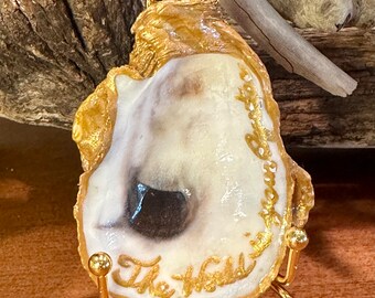 Real oyster shell, beach combed along the northern Outer Banks of NC with “The World is your Oyster” hand painted on it. *Large oyster*