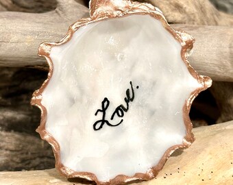 Hand painted oyster shell from Florida’s gulf coast with “Love.” written on it. BEAUTIFUL SMALL shell - covered in barnacles. Stand add’l.