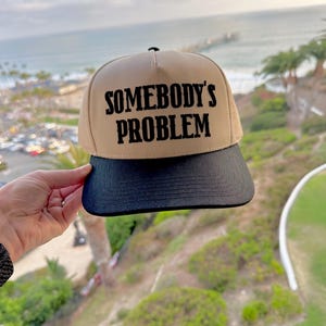 Somebody’s Problem Couple Hats, Khaki /black trucker Hat