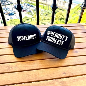 Somebody’s Problem  black  trucker Hat