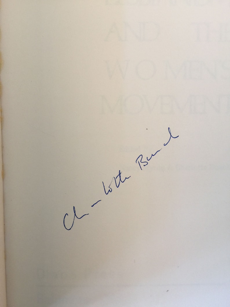 May include: A white page with blue ink handwriting that says "C - to the Bush"