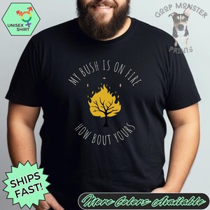 May include: Black t-shirt with a graphic of a yellow tree on fire with the text "My bush is on fire. How bout yours?"