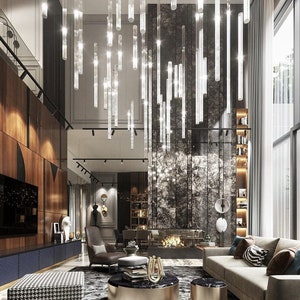 May include: A modern living room interior with a striking chandelier of hanging lights. The room features a fireplace, a sofa, and a patterned rug. The colour scheme includes wood, gold, and neutral tones, creating a luxurious atmosphere.