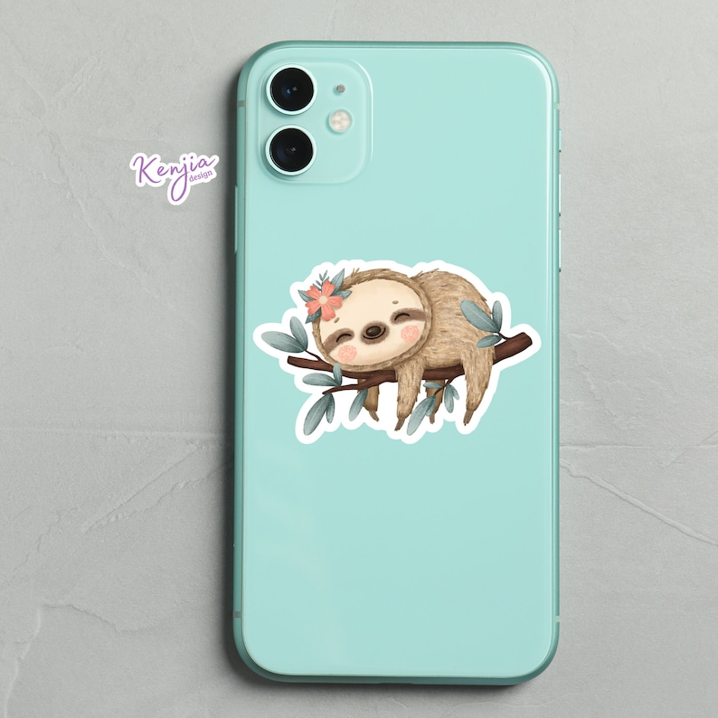 May include: A cute cartoon sloth with a pink flower on its head is sleeping on a branch with green leaves. The sloth is brown and has a white belly. The background is a light blue phone case.