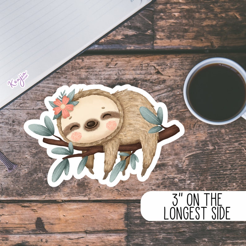 May include: A cute cartoon sloth with a pink flower on its head is sleeping on a branch with green leaves. The sticker is 3 inches on the longest side.