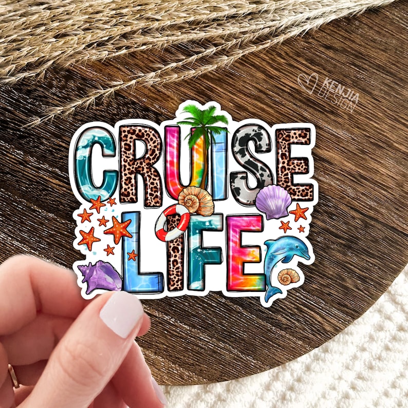 May include: A colorful sticker with the text "Cruise Life" in a rainbow tie-dye font. The sticker features a variety of beach-themed elements, including palm trees, seashells, starfish, and a dolphin.