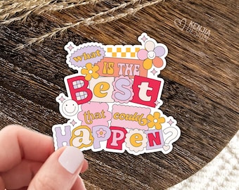 May include: A die-cut sticker featuring the text "WHAT IS THE BEST THAT COULD HAPPEN?" in a colourful, retro-inspired font. The design includes yellow, pink, and purple flowers, a checkered pattern, and a small smiley face icon on a white background.