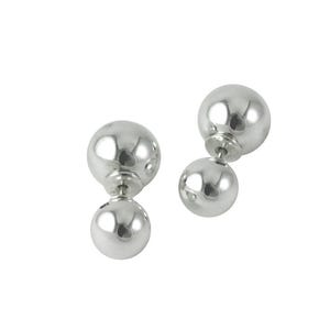 May include: A pair of silver-colored double-sided ball earrings. Each earring features a larger ball connected to a smaller ball. The earrings have a shiny, reflective surface, and are set against a white background.