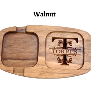 May include: A serving tray made from walnut wood with two compartments. One compartment features a personalised monogram with the letter T and the name TORRES.