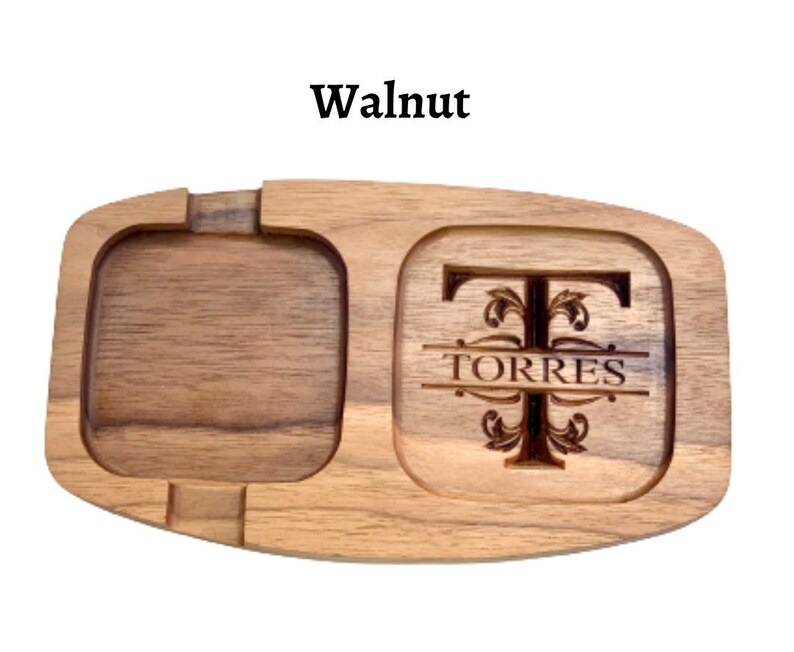 May include: A serving tray made from walnut wood with two compartments. One compartment features a personalised monogram with the letter T and the name TORRES.