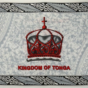 May include: A white flag with a red crown and the words "Kingdom of Tonga" in red lettering. The crown has a cross on top and is surrounded by a white and gray patterned border.