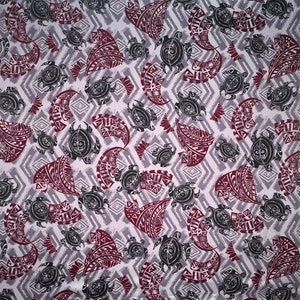 May include: A repeating pattern featuring stylized black turtles and maroon tribal designs on a light gray background with a diamond pattern. The design is suitable for fabric or wallpaper.