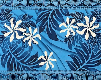 May include: A blue and white patterned fabric with a traditional Hawaiian design. The fabric features white flowers and dark blue leaves on a light blue background.