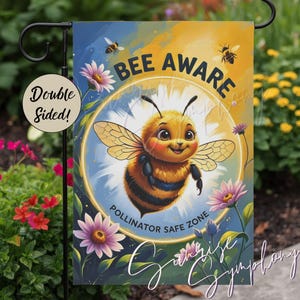 May include: A double-sided garden flag with a cheerful cartoon bee at the center, surrounded by the words "BEE AWARE" and "POLLINATOR SAFE ZONE." The flag features a blue and yellow background with flowers and bees.