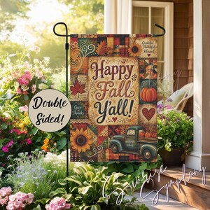 May include: A rectangular garden flag featuring a patchwork design with autumn motifs including sunflowers, maple leaves, and a vintage truck. The text reads Happy Fall Y'all and Give Thanks. A circular overlay states Double Sided.