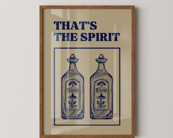 May include: A framed wall art print featuring a beige background with dark blue text that reads THAT'S THE SPIRIT. Below the text, two illustrated tequila bottles are enclosed in a dark blue rectangular border, each displaying a cactus and sombrero.