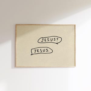 May include: A framed print with a beige background and the words "JESUS?" and "JESUS." in black, handwritten-style text within speech bubbles. The frame is a light brown color.