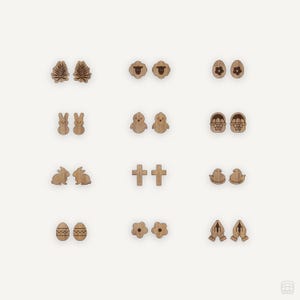 May include: A collection of wooden earrings in various Easter-themed designs. The earrings include leaf shapes, sheep, eggs, bunnies, chicks, baskets, crosses, witch hats, flowers, and praying hands. The earrings are light brown and have a natural wood grain.