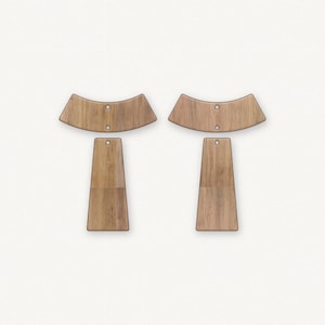 May include: Two wooden earring sets with a curved top and a rectangular bottom. The earrings are made of light brown wood with a natural grain pattern.