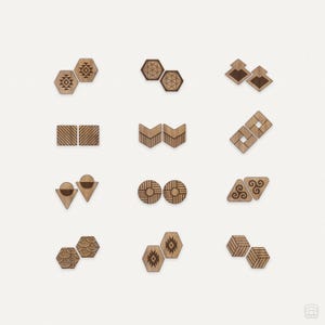 May include: Set of 10 wooden coasters with various geometric and abstract designs. The coasters are made of natural wood and have a light brown color.