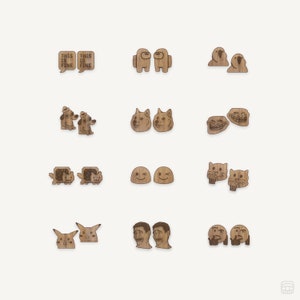 May include: Set of 10 pairs of wooden earrings featuring popular internet memes. The earrings are laser-cut and engraved with designs such as Doge, This is Fine, and Among Us.