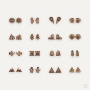 May include: Set of 20 wooden winter-themed earrings. The earrings feature various designs, including snowflakes, mittens, snowmen, cabins, trees, penguins, and more.