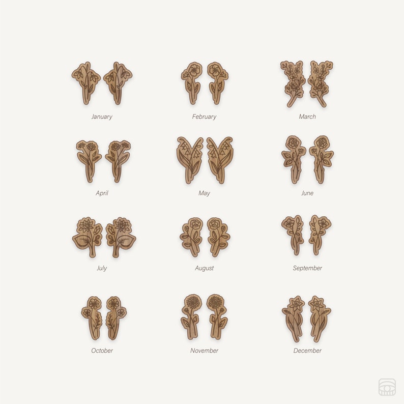 May include: Twelve wooden flower earrings, each pair representing a different month of the year. The earrings are brown and feature a variety of floral designs, including lilies, sunflowers, and daisies.
