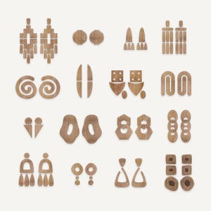 May include: A collection of wooden earrings in various geometric shapes, including spirals, teardrops, and abstract figures. The earrings are light brown and arranged on a white background.
