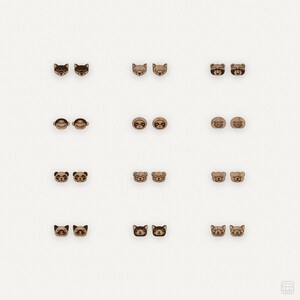 May include: A set of 10 pairs of wooden earrings featuring various animal designs, including raccoons, foxes, bears, monkeys, sloths, pandas, and cats.