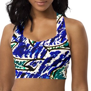 May include: A blue, green, and white patterned sports bra with a racerback style.