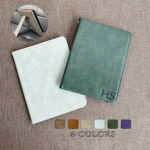 May include: Two leather-bound journals with personalised initials, "HS" and "RAO", in a green and white colour scheme. The journals are displayed on a brown textured surface. 6 colours are available.