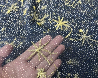 May include: Black mesh fabric with gold glitter dots and gold embroidered stars and palm trees.