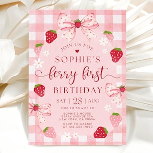May include: A pink and white gingham-patterned invitation with the text "Sophie's berry first birthday." The invitation features illustrations of strawberries, bows, and flowers. The date and time of the party are also included.