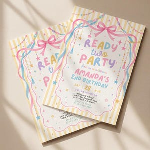 May include: Two rectangular birthday invitation cards with yellow and white vertical stripes. The text reads READY TWO PARTY, AMANDA'S 2ND BIRTHDAY, SAT 28 AUG, 2:00 PM TO 4:00 PM, AMELIA'S HOUSE, THIRTEEN AVENUE 99A, NEW YORK, CA 90554, RSVP TO ALMA AT 123-456-7890.