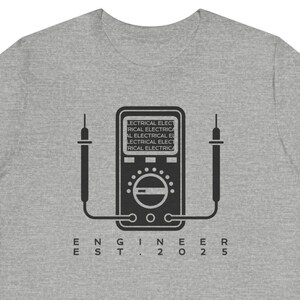 May include: Gray t-shirt with a black and white illustration of a multimeter and the text "ENGINEER EST. 2025".