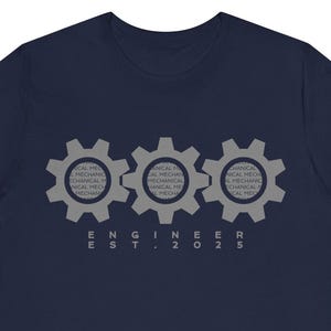May include: Navy blue t-shirt featuring three grey gears and the text "ENGINEER EST. 2025".